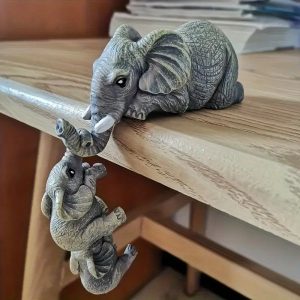Fun Ceramic Elephant Ornaments Designed to Hang Playfully By Their Trunks From any Surface These Little Guys Bring Instant Humor and Charm
